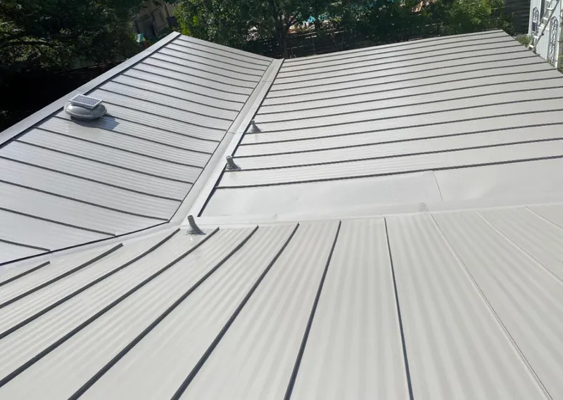 Solar attic fan installed on a metal roof for Roof Ventilation in Gulf Gate